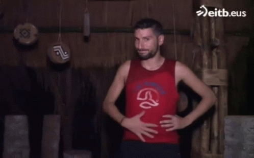 Man Red Tank Top Hands On Hips Eitb.eus GIF