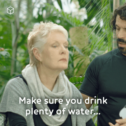 Man Reminding Old Woman To Drink Water Plenty GIF