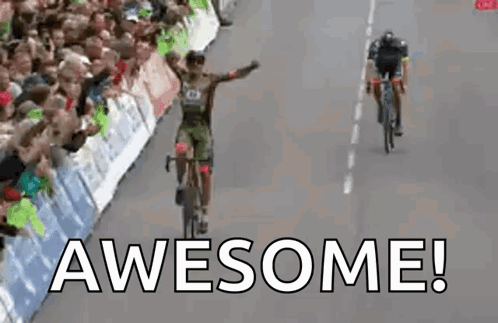 Man Riding Bike Down Road Saying Awesome