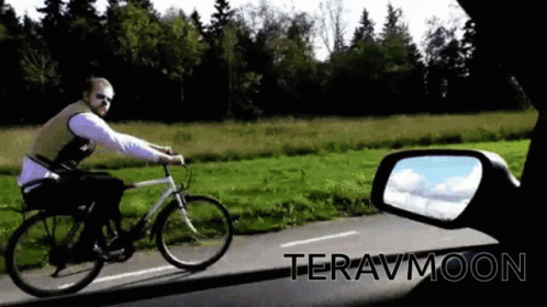 Man Riding Bike Down Road Teravmoon