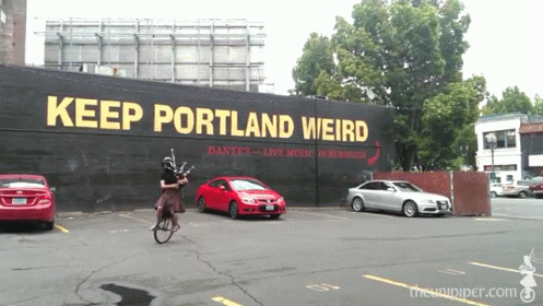 Man Riding Bike Keep Portland Weird Sign