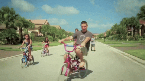Man Riding Bike With Kids GIF