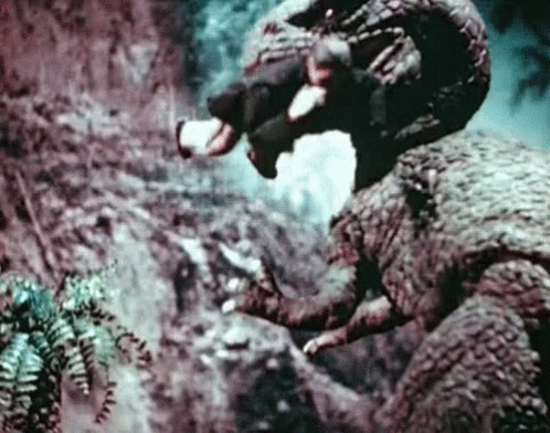 Man Riding Dinosaur GIF