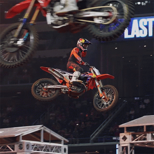 Man Riding Dirt Bike Near Last Sign