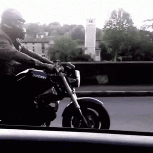 Man Riding Ducati Motorcycle