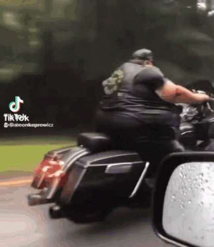 Man Riding Harley Davidson Motorcycle