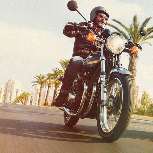 Man Riding Kawasaki Motorcycle