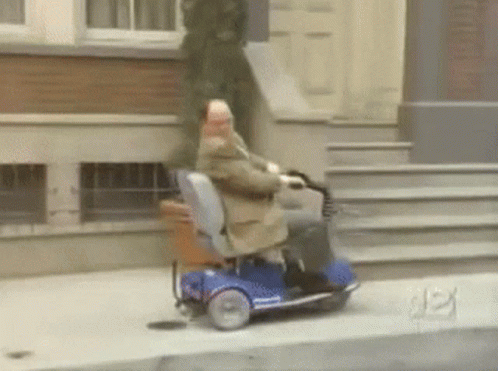 Man Riding Mobility Scooter