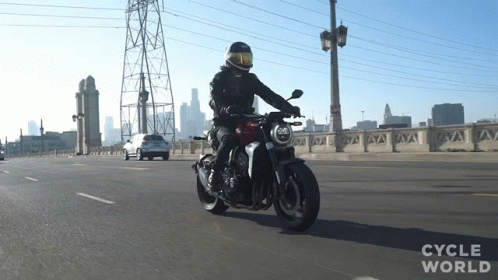 Man Riding Motorcycle on Bridge Cycle World