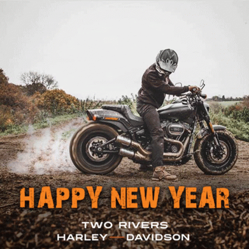 Man Riding Motorcycle on Dirt Road Saying Happy New Year