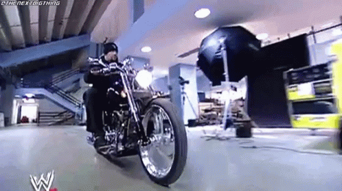 Man Riding Motorcycle With Camera