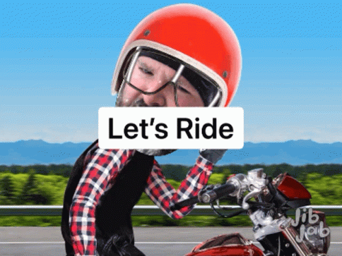 Man Riding Motorcycle with Lets Ride Sign