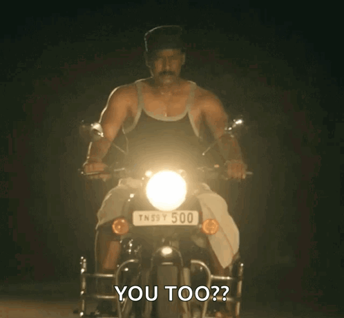 Man Riding Motorcycle With License Plate TN39Y500