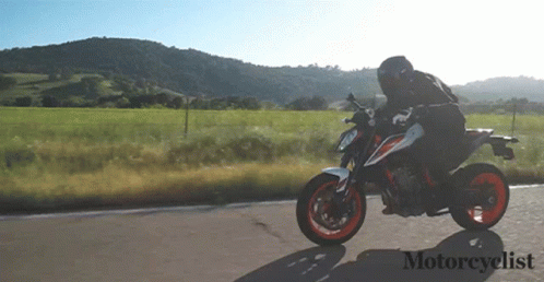Man Riding Motorcycle With Word Motorcyclist GIF