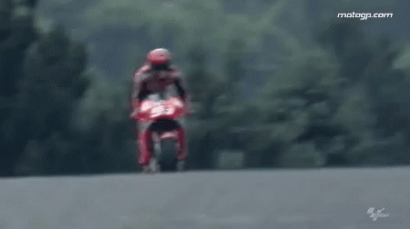 Man Riding Red Motorcycle On Track GIF