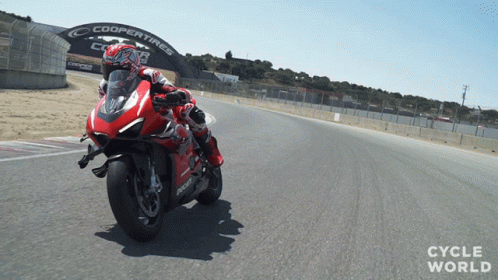 Man Riding Red Motorcycle With Coopertires Sign GIF