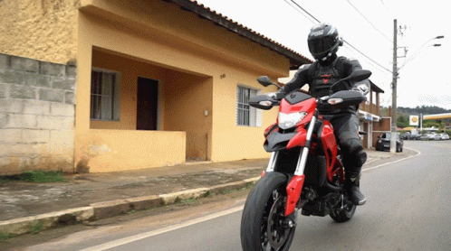 Man Riding Red Motorcycle