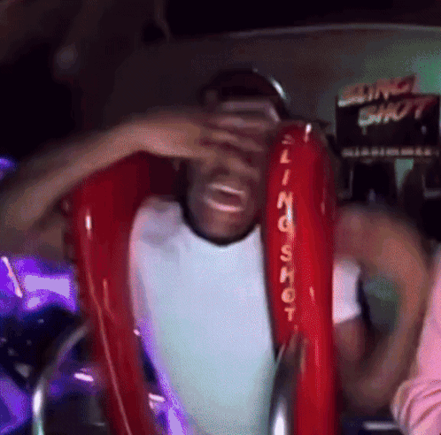 Man Riding Red Slingshot Ride
