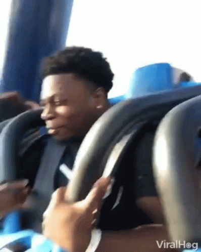 Man Riding Roller Coaster Looking At Phone GIF