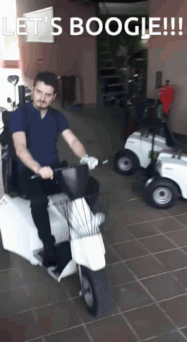 Man Riding Scooter Saying Let's Boogie