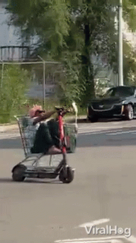 Man Riding Shopping Cart Scooter