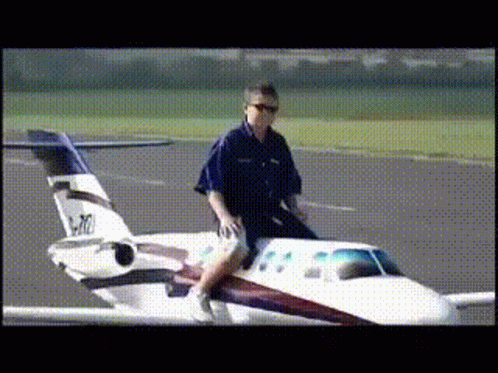 Man Riding Small Airplane P-10