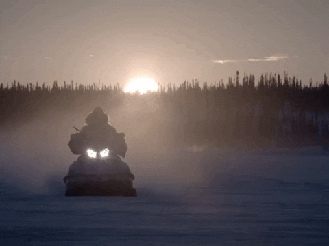 Man Riding Snowmobile Sunset Silhouette GIF