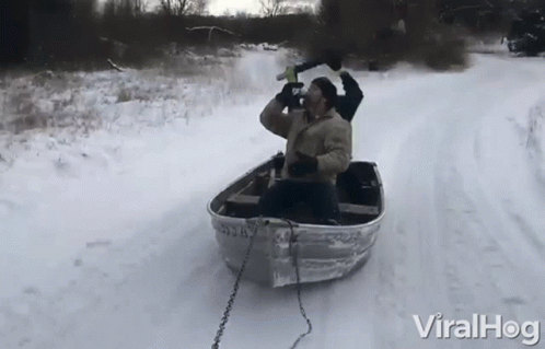 Man Row The Boat On Snow While Drinking GIF