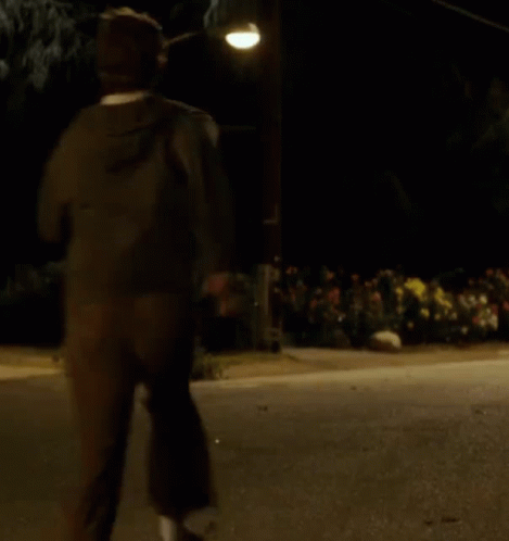 Man Running at Night Under Street Light