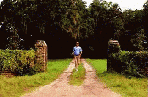 Man Running Down Dirt Road