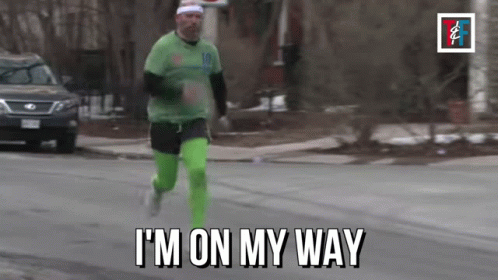 Man Running Down Street Saying Im On My Way