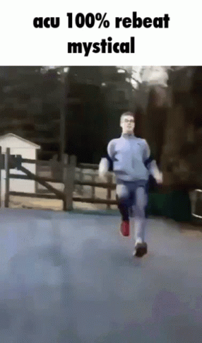 Man Running Down Street With Acu 100% Rebeat Mystical