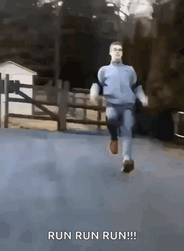 Man Running Down Street With Words Run Run Run GIF