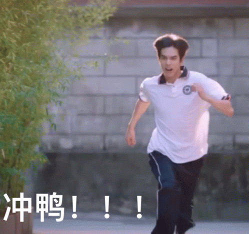 Man Running in White Shirt Near Brick Wall