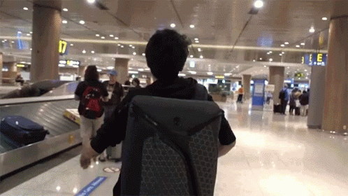 man-running-inside-airport-1b2xbh4otf3tol9r.gif