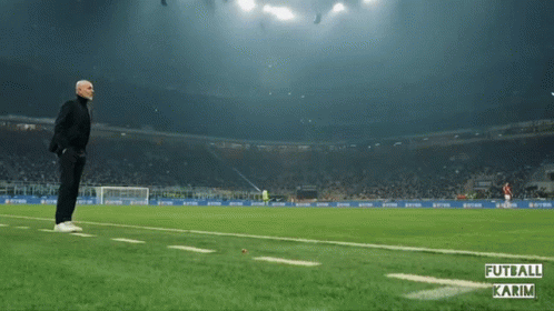 Man Running on Soccer Field Futball Karim