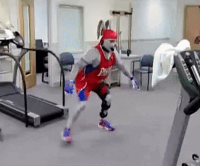 Man Running on Treadmill in Phillies Jersey