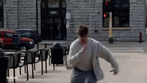 Man Running Past Brick Building 1284