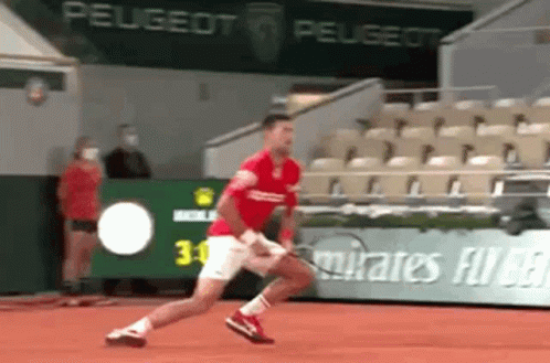 Man Running Past Peugeot Ad on Tennis Court