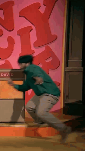 Man Running Towards Box Saying David