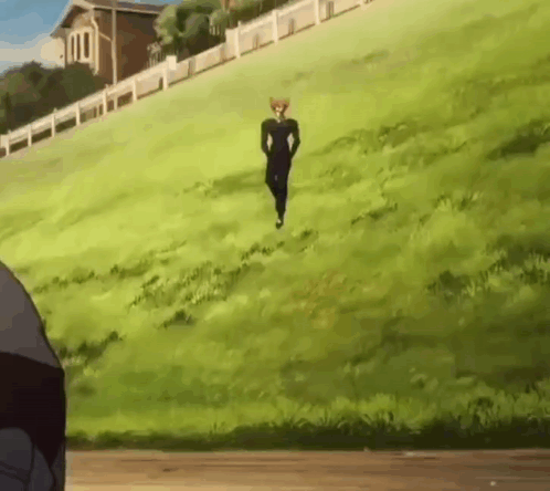 Man Running Up Grassy Hill