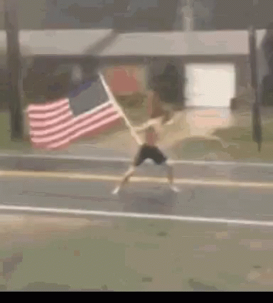 Man Running with American Flag Behind
