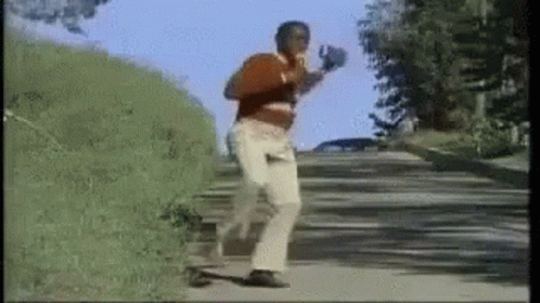 Man Running With Boxing Gloves and Red Shirt