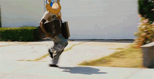 Man Running With Cartoon Monkey on Head
