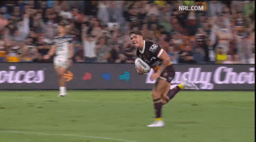 Man Running With Rugby Ball in Front of NRL.com Banner