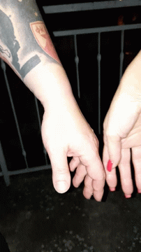 Man's Arm With NP Tattoo