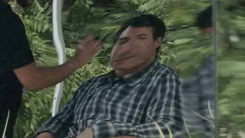 Man's Distorted Reflection On Mirror GIF