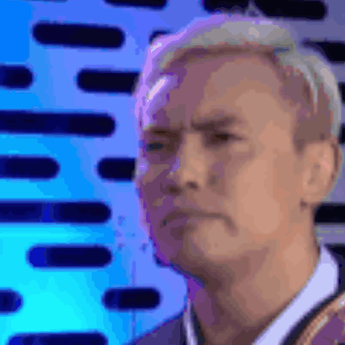 Man's Face Close Up Blue Background