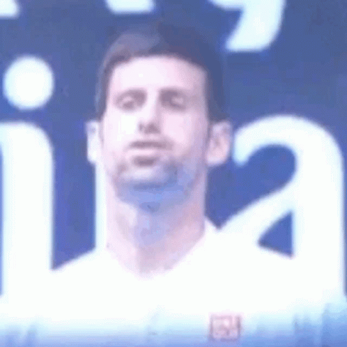 Man's Face Close Up Blue Background White Shirt
