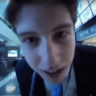 Man's Face Close Up In Front Of Break All Sign GIF